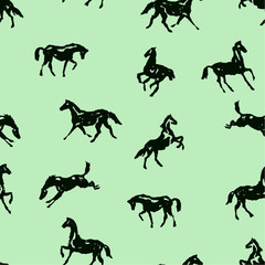 Pattern with silhouette horses in various poses and motion. Seamless vector background with hand drawing horses. Black on green  color England equestrian sport traditional style for fashion fabric.