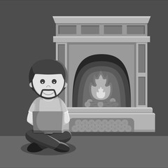 Black and white man playing laptop near fire place