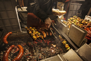 Meat sausages and skewers on barbecue grill