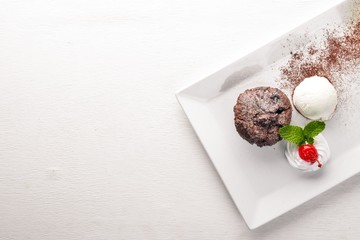 Chocolate ice cream cake. On a wooden background. Free space for your text. Top view.