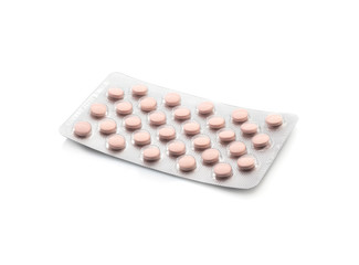 Medicinal pink pills with expired shelf life on a white background. Isolated