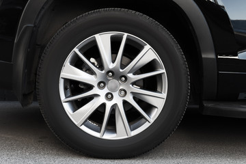 Obraz premium Modern automotive wheel on light alloy disc