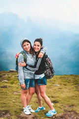 Obraz premium Girls posing against the background of the mountains