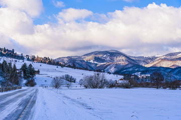 beautiful landscape with winter mountain road