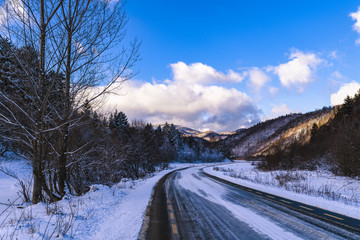 beautiful landscape with winter mountain road