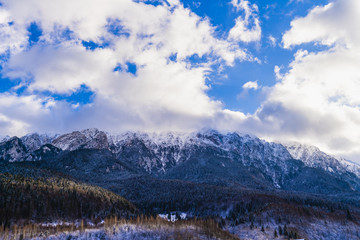 Fototapeta na wymiar Beautiful winter landscape with Carpati Piatra Craiului mountains in Romania
