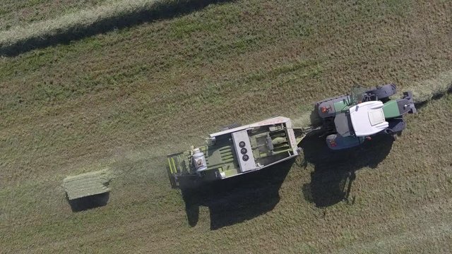 aerial hay bale production from above close up 4k