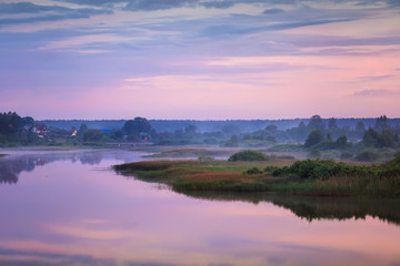 Fototapeta na wymiar Foggy summer sunrise on the river.