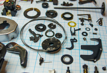 parts old retro film SLR camera on graph paper