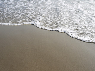 sand beach with water sea closeup