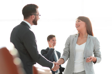 handshake between colleagues in the workplace