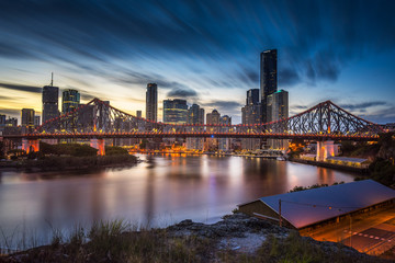 Long exposure of the Story Bridge with the Brisbane skyline in the background  - obrazy, fototapety, plakaty