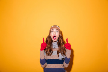 Portrait of an excited girl dressed in winter clothes