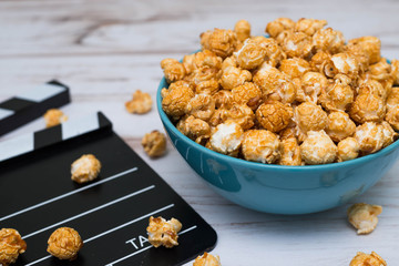Clapperboard and popcorn