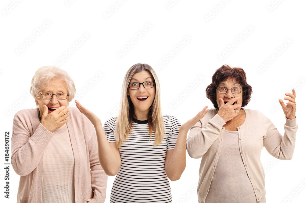 Wall mural Two elderly women and a young woman making surprise gestures