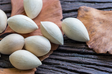 Ginkgo biloba (seeds) on the background wood.