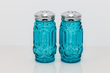 blue glass and silver topped salt and pepper shakers
