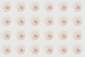 top view of white glazed doughnuts seamless pattern isolated on white