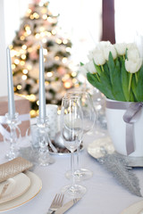  Elegant dining table and Christmas tree in living room