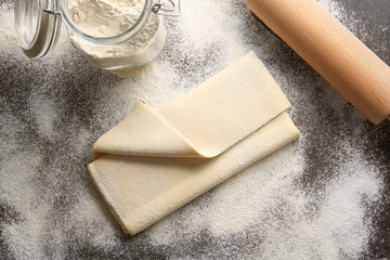 Fresh raw puff dough on table