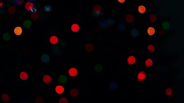 Festive blinking out of focus colorful holiday lights