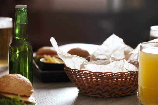 Table served with beer and snacks in sport bar