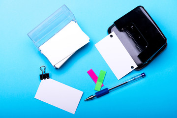 Business card in card holder and binders. Stationery and cards
