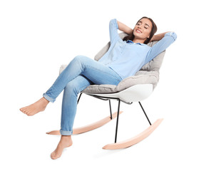 Fototapeta premium Young woman resting in rocking chair on white background