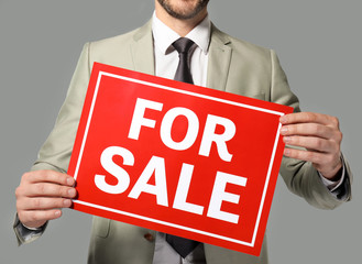 Real estate agent holding 