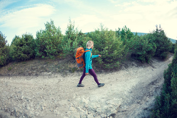 A girl with a backpack.