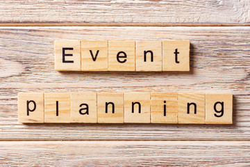 Event planning word written on wood block. Event planning text on table, concept