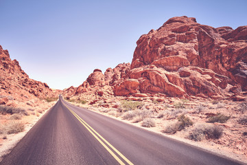 Desert road, travel adventure concept, color toned image, Nevada, USA.