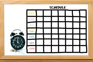 Schedule investment Concept : Grid time table on white chalkboard background