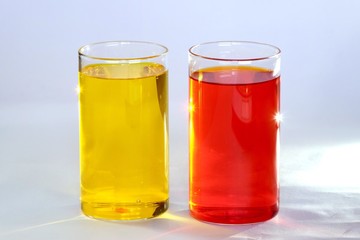 Fototapeta na wymiar Glass of Yellow red juice sparkling highlight on glassey