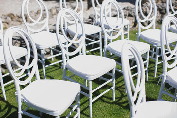 White chair decorating for wedding ceremony