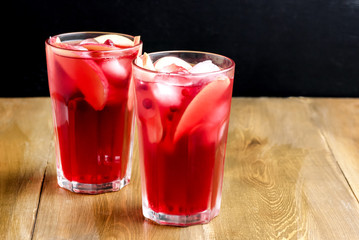 Glass of Cold Winter Drink With Fresh Cranberry and Apple Cold Horizontal Photo Wooden Background Copy Space Berry Ice Tea