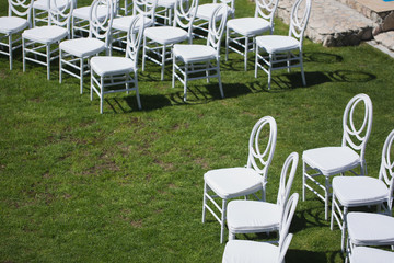 White chair decorating for wedding ceremony