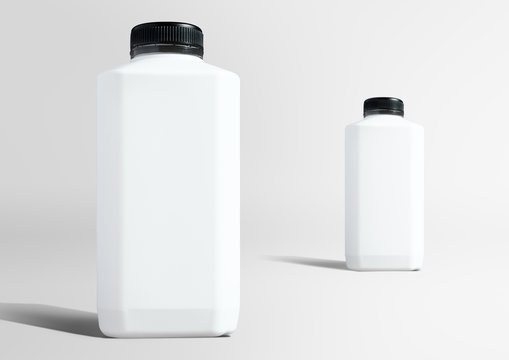 Blank white plastic bottles setting up in studio ready to use as mockup