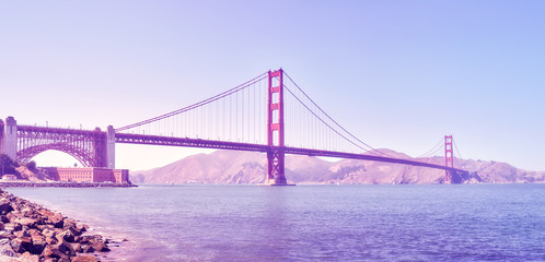 Panoramic picture of the Golden Gate Bridge at sunset, color toned image, San Francisco, USA.