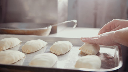 Cooks fill pies with stuffing