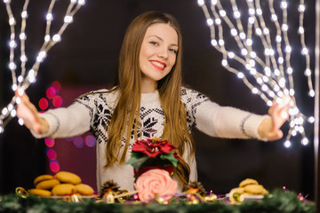 Confectioner preparing her shop for holidays season