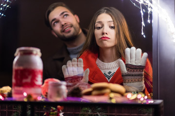 Young woman saddened she couldn't have another cake at the confectionery shop