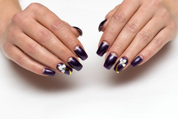 Purple moon manicure with flowers on long square nails on a white background
