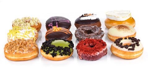 Colorful and tasty donuts on white background