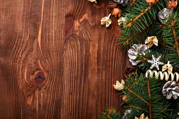 Christmas background with xmas tree and sparkle bokeh lights on wooden canvas background. Merry christmas card. Winter holiday theme. Happy New Year. Space for text. Happy Holidays