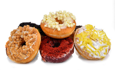 Colorful and tasty donuts on white background