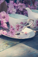 Beautiful, English, vintage teacup with Japanese cherry tree blossoms, close upt