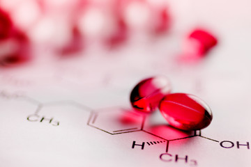 Painkiller tablets - pink caps with molecules chemical formulas - healthcare and medicine