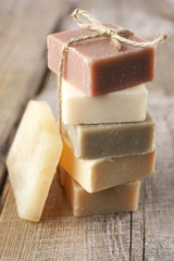 Assorted natural soap bars on wood