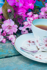 Beautiful, English, vintage teacup with Japanese cherry tree blossoms, close upt
